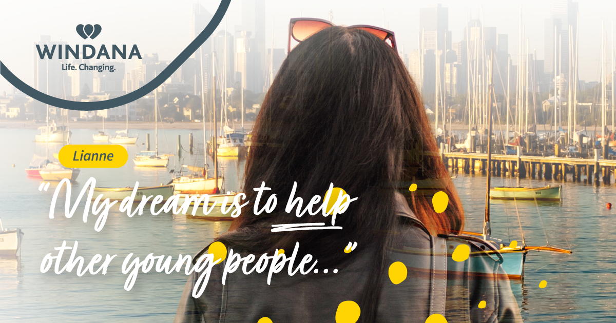 A person with long brown hair looking out across the bay towards to the city. On top of the photo is the Windana logo, the name "Leanne" and the text "My dream is too help other young people..."